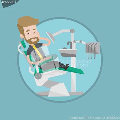 Image of Man suffering from toothache in dental chair.