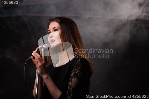 Image of Studio photo of singing girl