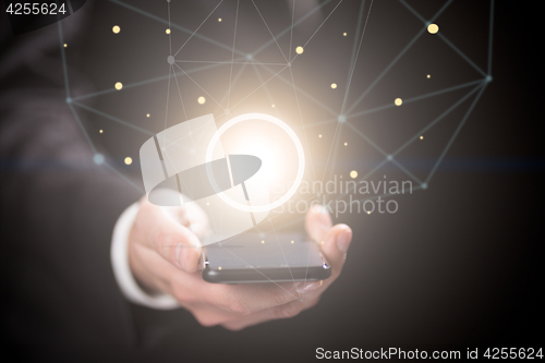 Image of Businessman holding crystal yellow ball