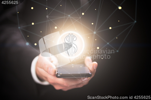 Image of Businessman with dollar sign coming out of smartphone. Virtual money