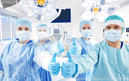 Image of group of surgeons in operating room at hospital