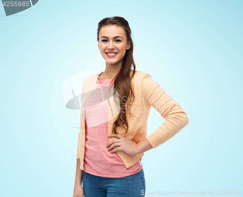 Image of happy smiling young woman in cardigan
