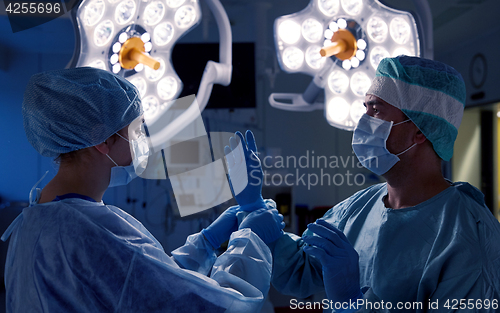 Image of surgeons in operating room at hospital