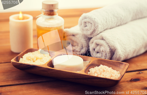 Image of close up of soap, himalayan salt and scrub in bowl