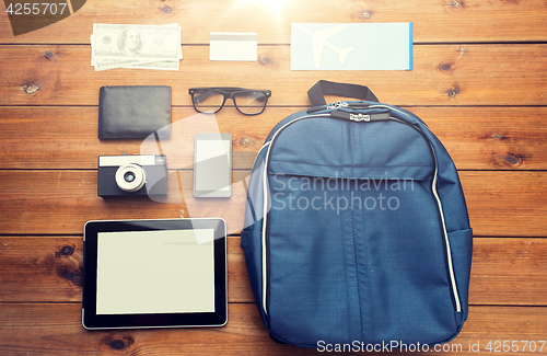 Image of close up of smartphone and travel stuff