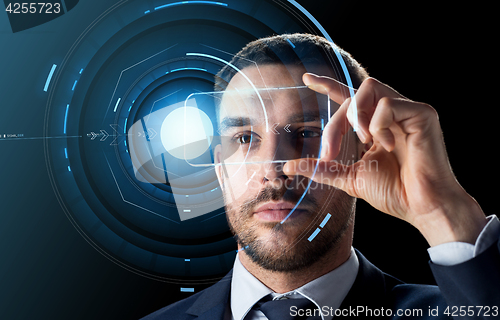 Image of businessman with transparent smartphone