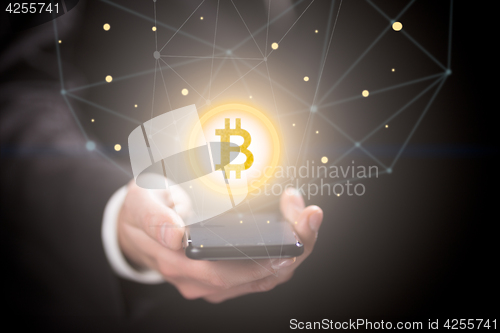 Image of Businessman with bitcoin sign , smartphone