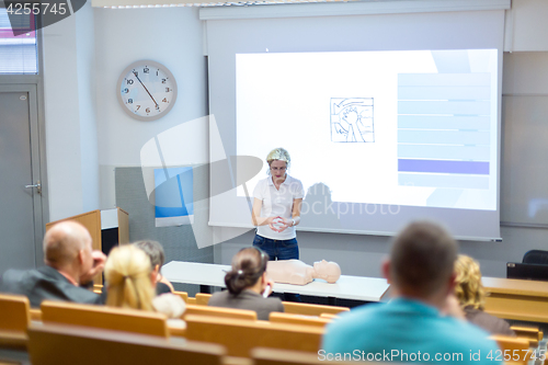 Image of Instructor teaching first aid cardiopulmonary resuscitation workshop.