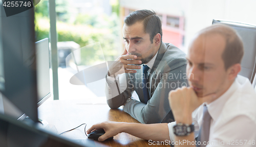 Image of Business team analyzing data at business meeting.