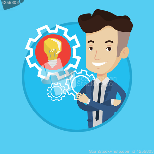 Image of Man with business idea bulb in gear.