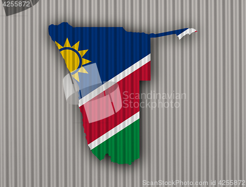 Image of Map and flag of Namibia on corrugated iron