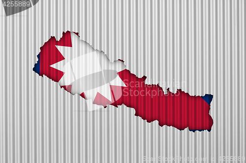 Image of Map and flag of Nepal on corrugated iron