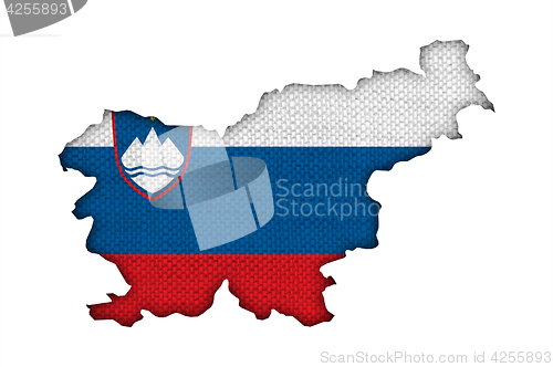 Image of Map and flag of Slovenia on old linen