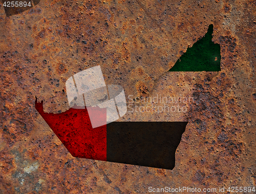 Image of Map and flag of United Arab Emirates on rusty metal