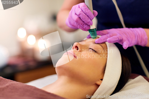 Image of woman having microdermabrasion facial treatment