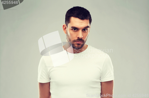 Image of young man portrait over gray background