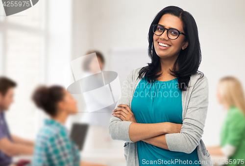 Image of happy smiling young indian woman in glasses