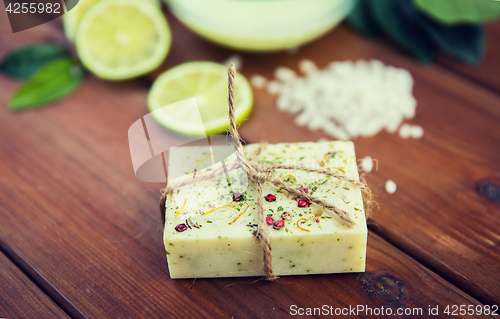 Image of close up of handmade herbal soap bar on wood