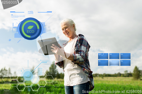 Image of senior woman with tablet pc computer at county