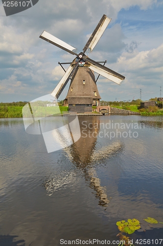 Image of Windmill beside a canal