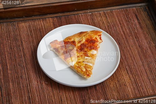 Image of Pizza slice on a plate