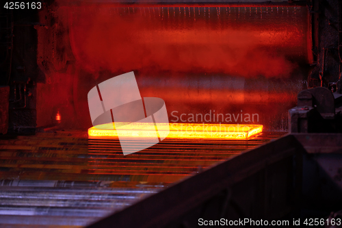 Image of Hot steel on conveyor