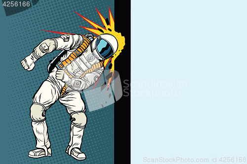 Image of Cosmonaut knocks head on the wall. Dream of mankind