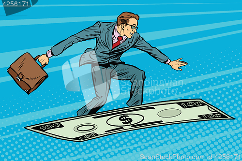 Image of Businessman on flying money carpet plane