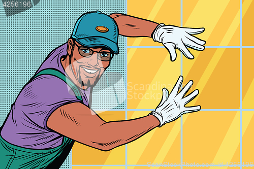 Image of worker Builder puts tile