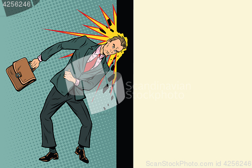 Image of Businessman breaks the wall with his head