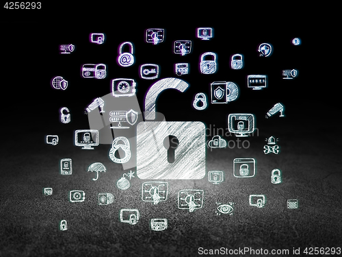 Image of Protection concept: Opened Padlock in grunge dark room