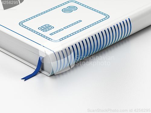 Image of Banking concept: closed book, Credit Card on white background