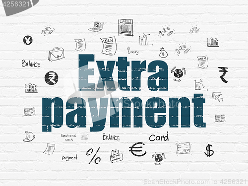 Image of Currency concept: Extra Payment on wall background