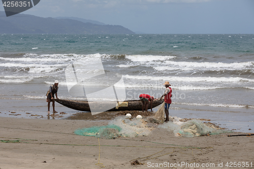 Image of Native Malagasy fishermen fishing on sea, Madagascar