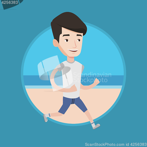 Image of Young sporty man jogging on the beach.
