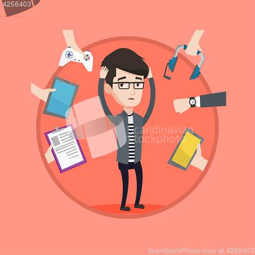 Image of Young man surrounded with his gadgets.