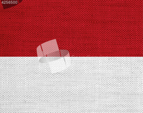 Image of Flag of Monaco on old linen