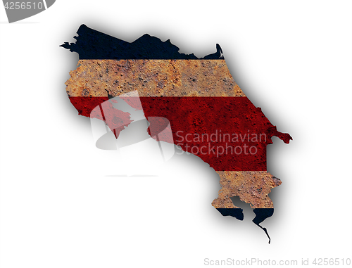 Image of Map and flag of Costa Rica on rusty metal