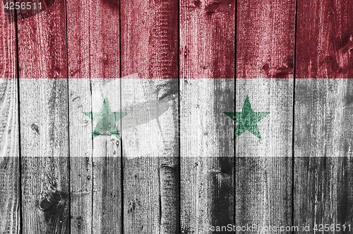 Image of Flag of Syria on weathered wood