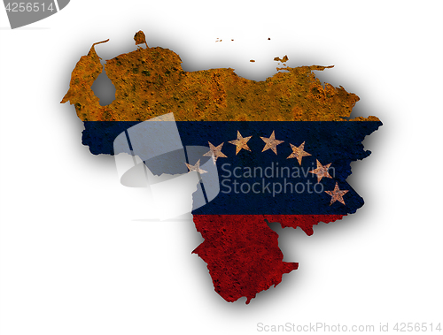 Image of Map and flag of Venezuela on rusty metal