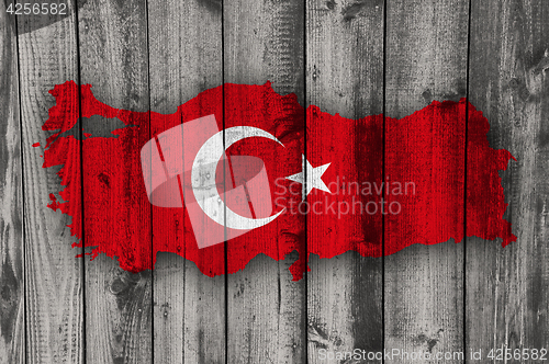 Image of Map and flag of Turkey on weathered wood