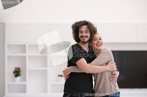 Image of couple hugging in their new home