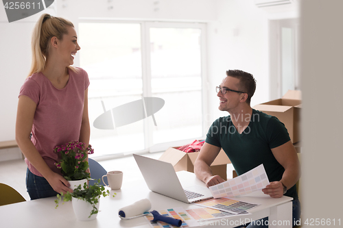 Image of Young couple moving in a new home