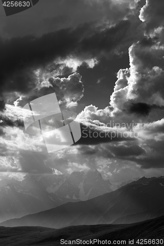 Image of Black and white view on mountains in sunlight clouds