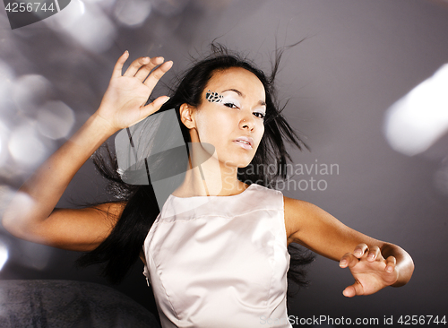 Image of fashion portrait beauty ice lady splashes of light in studio, cr