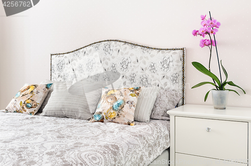 Image of elegant bedroom in soft light colors