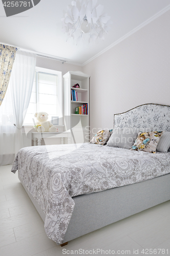 Image of elegant bedroom in soft light colors