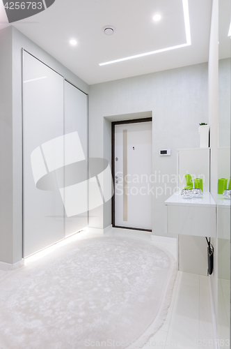 Image of modern white apartment hallway