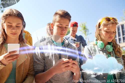 Image of group of teenage friends with smartphones outdoors