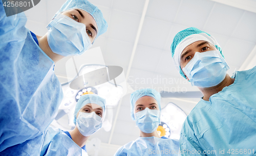 Image of group of surgeons in operating room at hospital